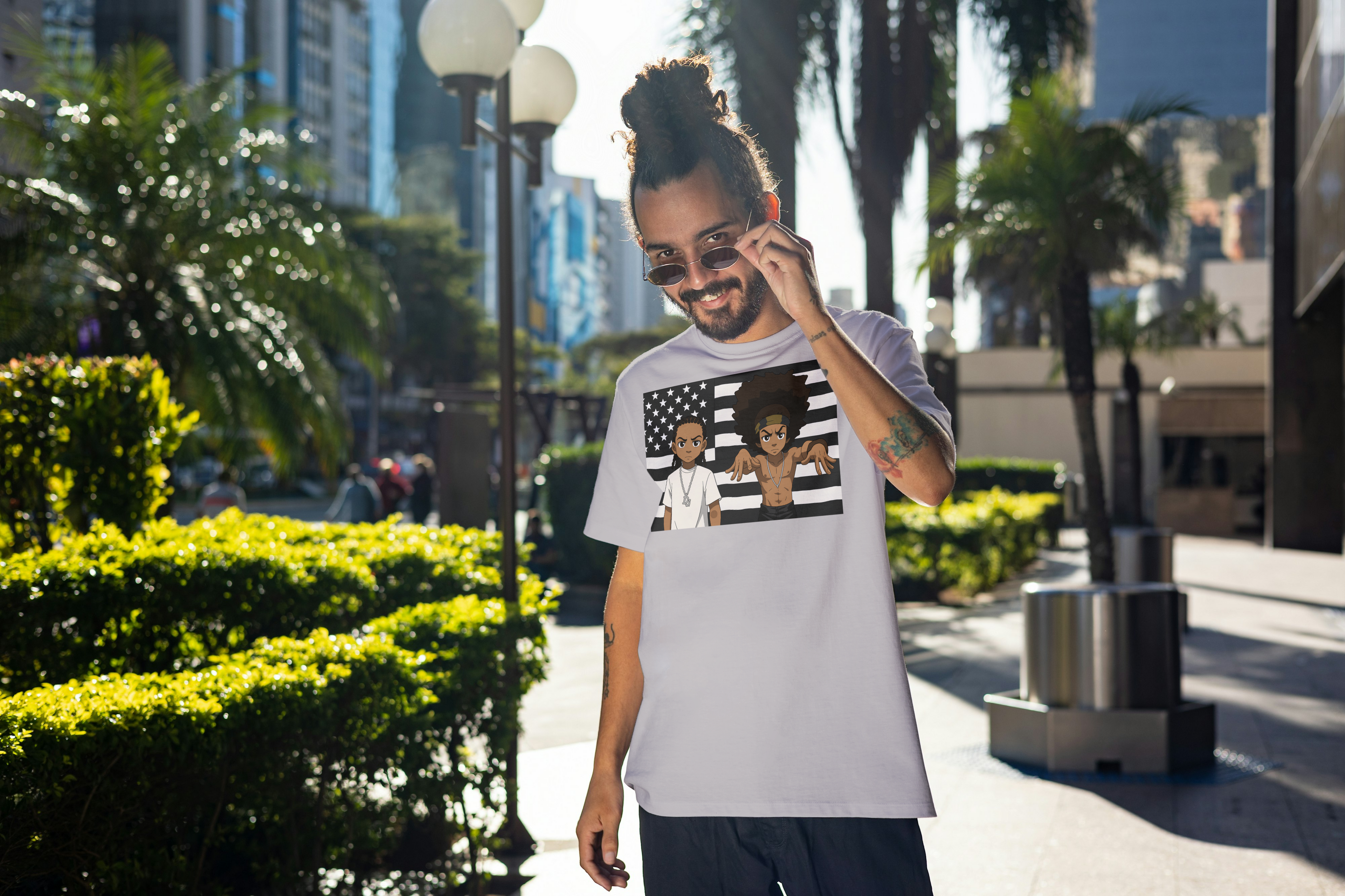 StankDocks Graphic Tee — Cartoon Duo Over Black & White American Flag